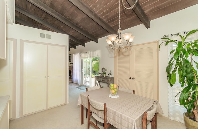 6338 N Maroa Ave Unit 115, Fresno, CA 93704 - dining space featuring light colored carpet, a chandelier, and wood ceiling