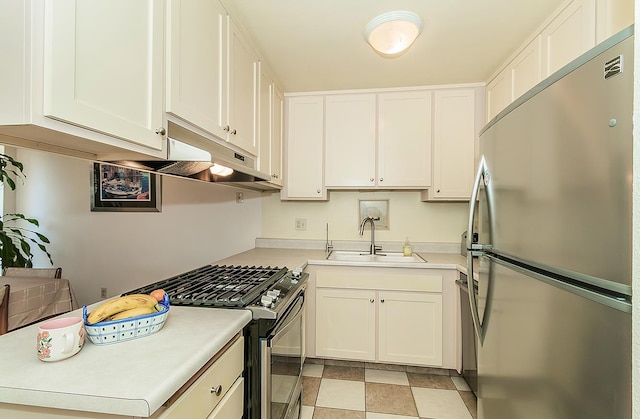 6338 N Maroa Ave Unit 115, Fresno, CA 93704 - kitchen with appliances with stainless steel finishes, light countertops, and white cabinetry