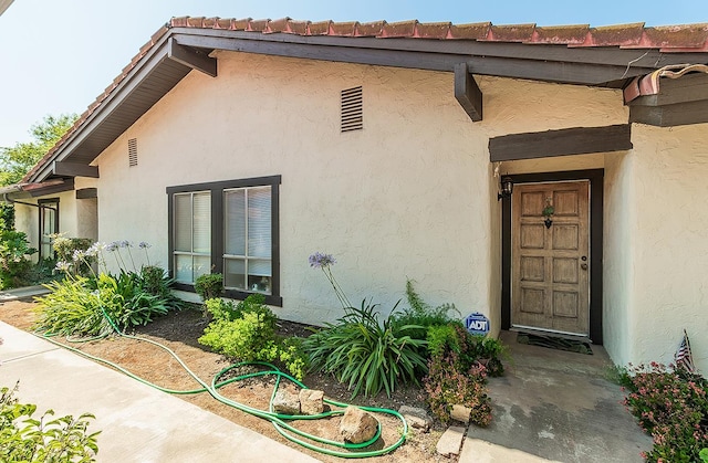 6338 N Maroa Ave Unit 115, Fresno, CA 93704 - doorway to property featuring stucco siding