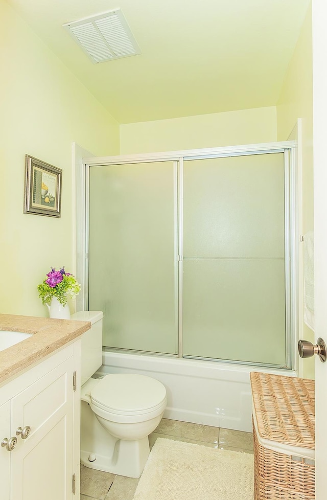 6338 N Maroa Ave Unit 115, Fresno, CA 93704 - bathroom with tile patterned floors, vanity, and combined bath / shower with glass door