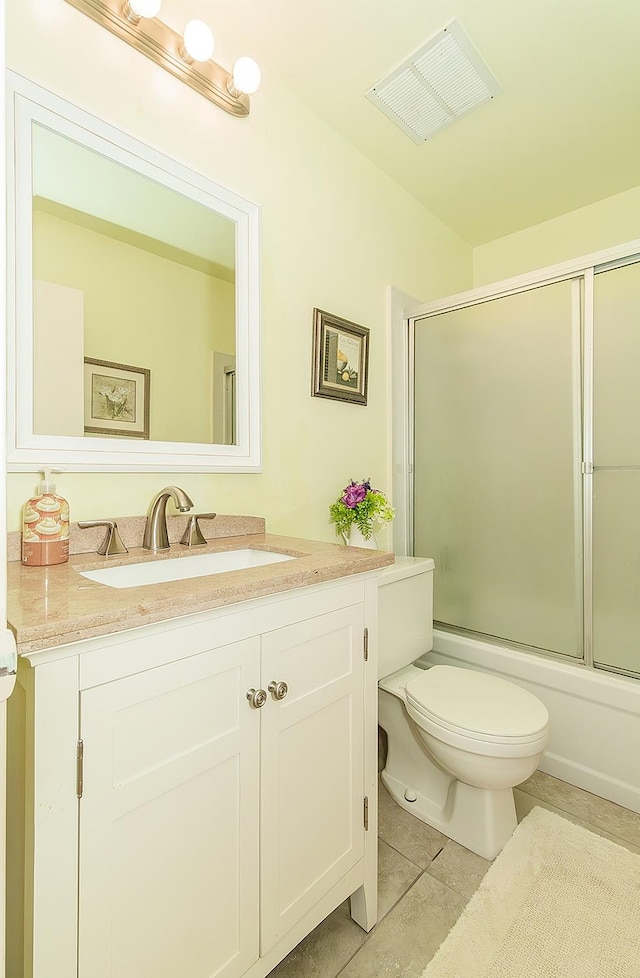 6338 N Maroa Ave Unit 115, Fresno, CA 93704 - full bathroom with vanity, tile patterned flooring, and bath / shower combo with glass door
