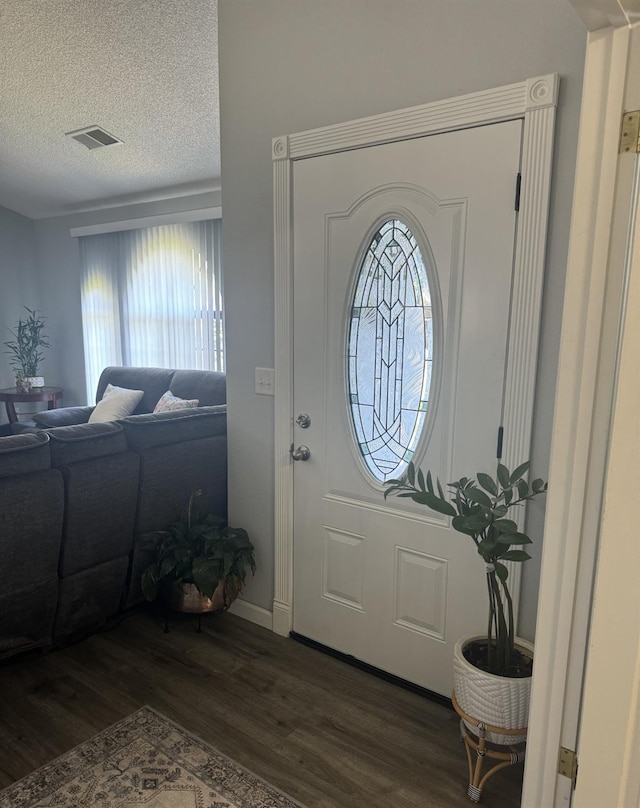 1723 Locust Ave, Clovis, CA 93611 - foyer featuring dark wood finished floors, plenty of natural light, and a textured ceiling