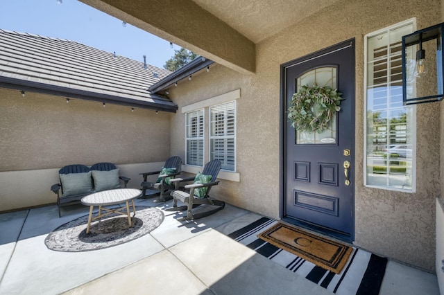 4994 W Minarets Ave, Fresno, CA 93722 - entrance to property featuring stucco siding and a patio area