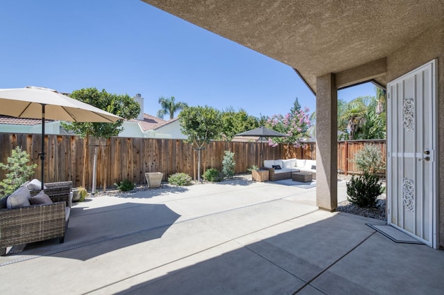 4994 W Minarets Ave, Fresno, CA 93722 - fenced backyard featuring outdoor lounge area and a patio