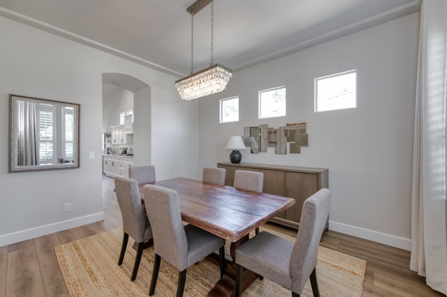 4994 W Minarets Ave, Fresno, CA 93722 - dining area with plenty of natural light, arched walkways, and wood finished floors