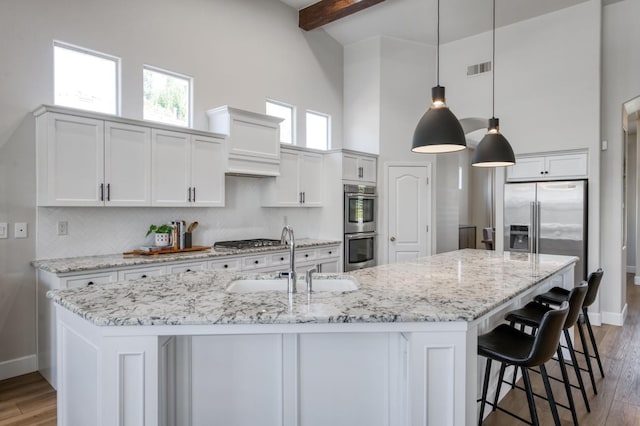 4994 W Minarets Ave, Fresno, CA 93722 - kitchen featuring high vaulted ceiling, appliances with stainless steel finishes, custom range hood, backsplash, and beamed ceiling