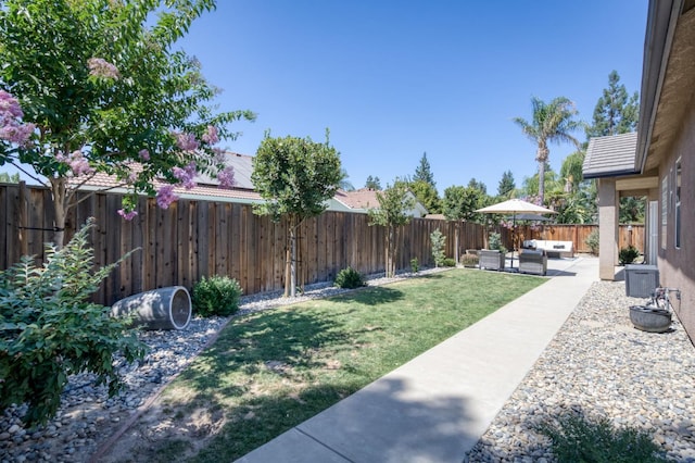4994 W Minarets Ave, Fresno, CA 93722 - fenced backyard with an outdoor living space and a patio