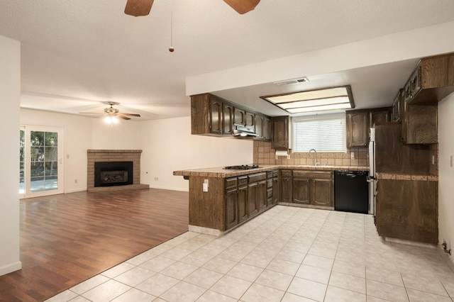 8298 N Calaveras St, Fresno, CA 93711 - kitchen featuring ceiling fan, dishwasher, dark brown cabinetry, and exhaust hood