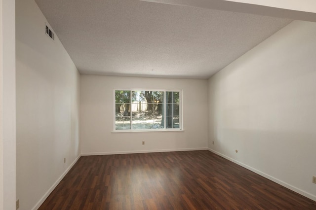 8298 N Calaveras St, Fresno, CA 93711 - spare room with dark wood-style flooring and a textured ceiling
