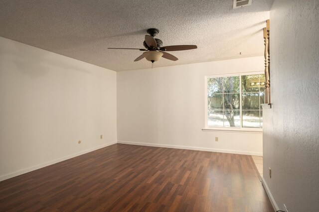 8298 N Calaveras St, Fresno, CA 93711 - spare room featuring a ceiling fan, dark wood finished floors, and a textured ceiling