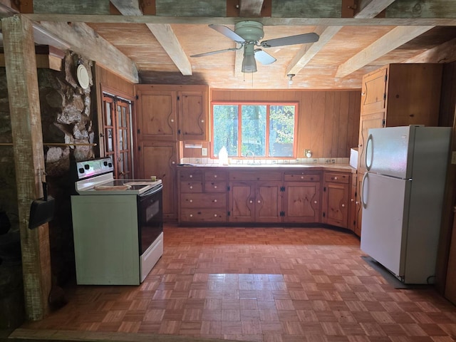83703 Hazel, Wilsonia, CA 93633 - kitchen with white appliances, beam ceiling, ceiling fan, light countertops, and wooden walls