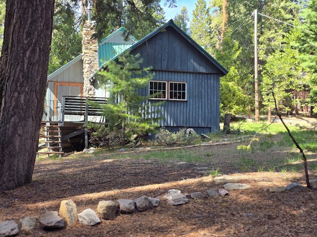 83703 Hazel, Wilsonia, CA 93633 - view of front of property with a chimney, stairway, and a deck