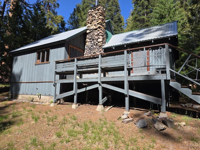 83703 Hazel, Wilsonia, CA 93633 - rear view of house featuring a chimney, a metal roof, and a deck