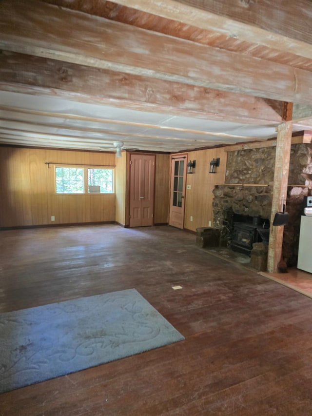 83703 Hazel, Wilsonia, CA 93633 - unfurnished living room featuring wood-type flooring, wood walls, and a stone fireplace