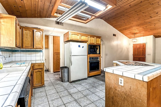 1401 S Villa Ave, Fresno, CA 93727 - kitchen featuring tile countertops, black appliances, wooden ceiling, vaulted ceiling, and light tile patterned floors