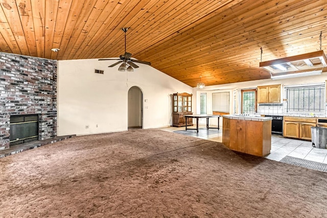 1401 S Villa Ave, Fresno, CA 93727 - kitchen with tile countertops, a kitchen island, black dishwasher, open floor plan, and ceiling fan