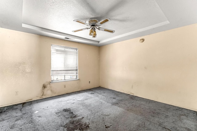 1401 S Villa Ave, Fresno, CA 93727 - empty room featuring a raised ceiling, a ceiling fan, a textured ceiling, carpet floors, and a smoke detector