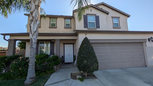 452 Rancho Mirage Rd, Madera, CA 93638 - view of front facade featuring stucco siding, concrete driveway, and a garage
