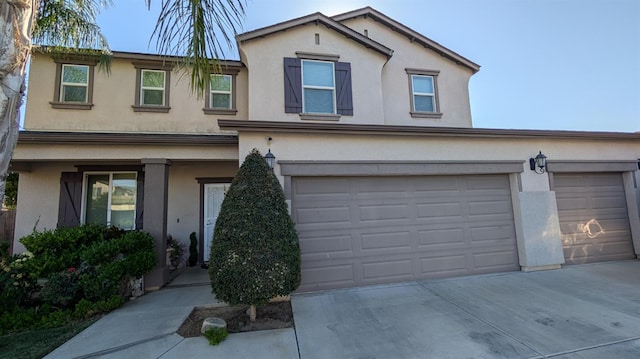 452 Rancho Mirage Rd, Madera, CA 93638 - traditional home with stucco siding, driveway, and an attached garage