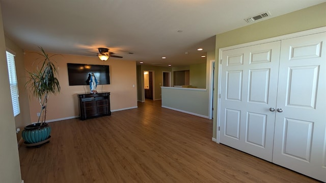 452 Rancho Mirage Rd, Madera, CA 93638 - unfurnished living room featuring wood finished floors, ceiling fan, and recessed lighting