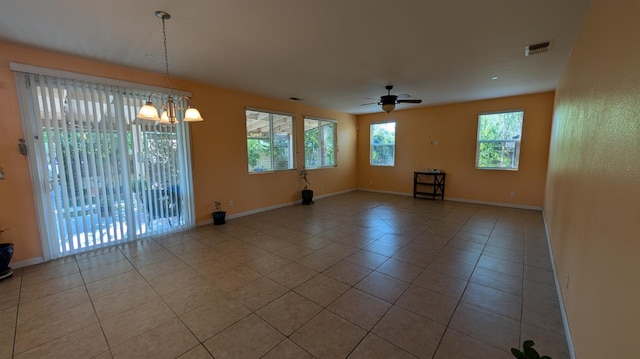 452 Rancho Mirage Rd, Madera, CA 93638 - tiled empty room featuring a chandelier and a ceiling fan