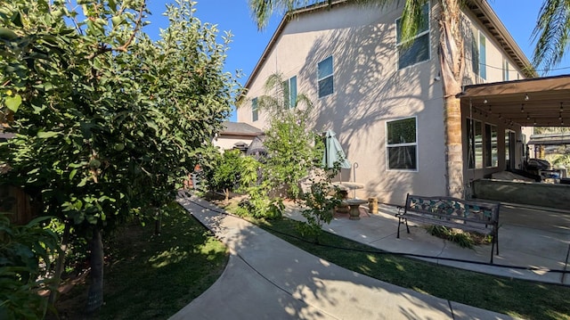 452 Rancho Mirage Rd, Madera, CA 93638 - view of property exterior with stucco siding and a patio