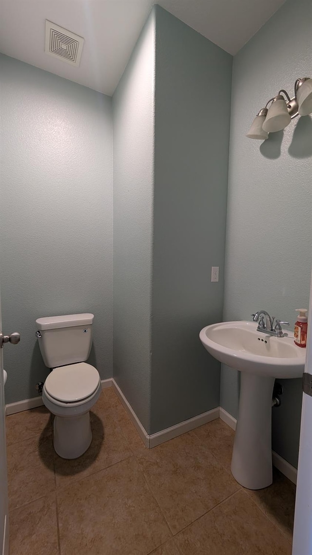 452 Rancho Mirage Rd, Madera, CA 93638 - half bathroom with tile patterned flooring