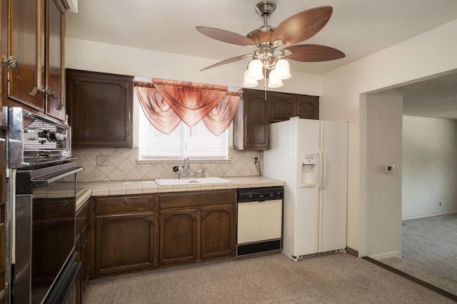 4835 E Normal Ave, Fresno, CA 93703 - kitchen with white appliances, dark brown cabinets, ceiling fan, backsplash, and tile countertops