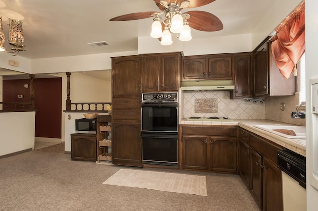 4835 E Normal Ave, Fresno, CA 93703 - kitchen featuring under cabinet range hood, ceiling fan, tile countertops, dishwasher, and dark brown cabinets