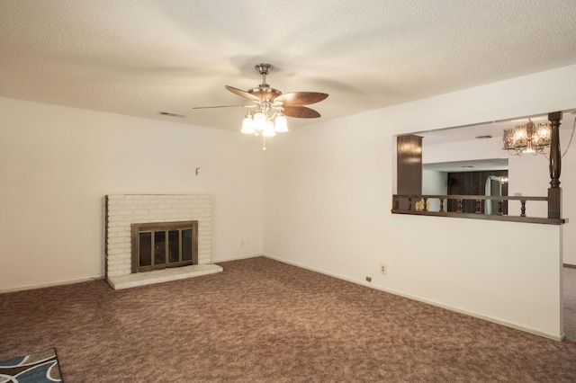 4835 E Normal Ave, Fresno, CA 93703 - unfurnished living room featuring carpet, ceiling fan, a fireplace, a textured ceiling, and a chandelier
