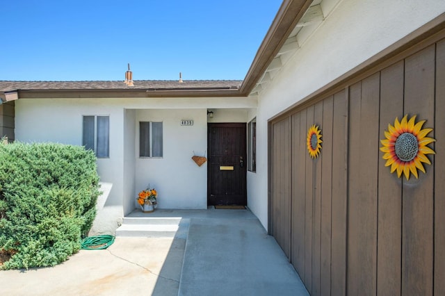 4835 E Normal Ave, Fresno, CA 93703 - property entrance featuring stucco siding and roof with shingles