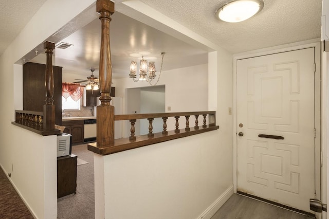 4835 E Normal Ave, Fresno, CA 93703 - entrance foyer with a ceiling fan, a textured ceiling, and a chandelier