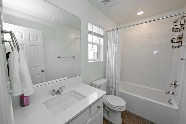 6317 E Malbec Dr, Fresno, CA 93727 - bathroom with vanity, shower / bath combo with shower curtain, wood finished floors, and recessed lighting