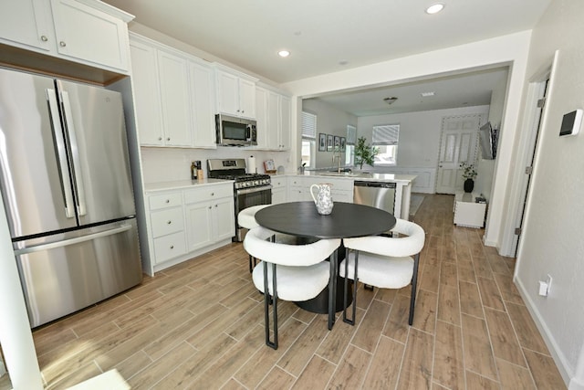 6317 E Malbec Dr, Fresno, CA 93727 - dining area featuring light wood-type flooring and recessed lighting