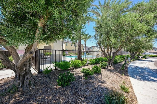 6317 E Malbec Dr, Fresno, CA 93727 - view of home's community with a pool