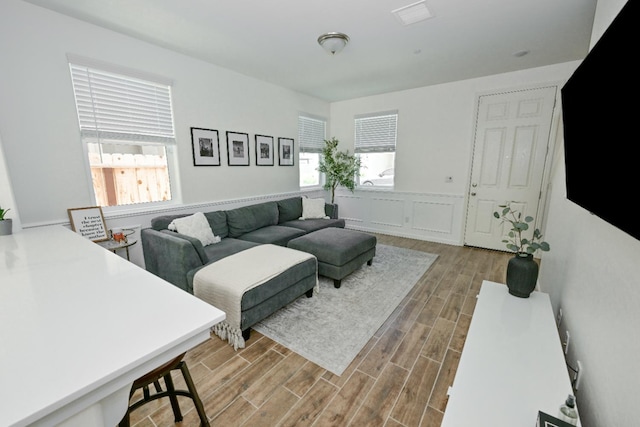 6317 E Malbec Dr, Fresno, CA 93727 - living area featuring wood finished floors and wainscoting