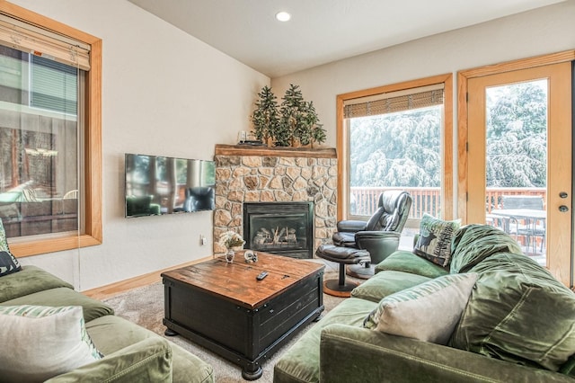 40862 Village Pass Ln, Shaver Lake, CA 93664 - living room with plenty of natural light, a stone fireplace, recessed lighting, and wood finished floors
