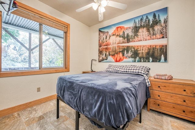 40862 Village Pass Ln, Shaver Lake, CA 93664 - bedroom featuring stone finish flooring and ceiling fan