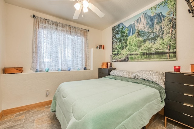 40862 Village Pass Ln, Shaver Lake, CA 93664 - bedroom with ceiling fan, stone finish floors, lofted ceiling, and a mountain view