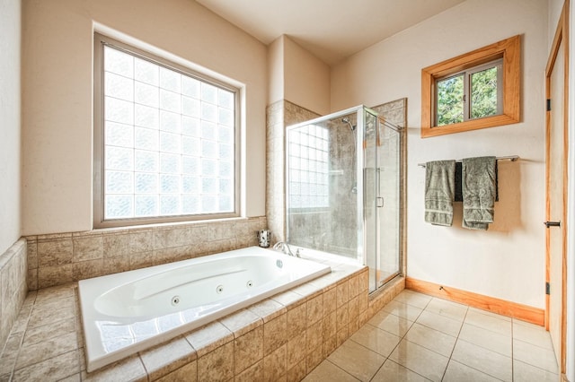 40862 Village Pass Ln, Shaver Lake, CA 93664 - bathroom with a stall shower, a jetted tub, and tile patterned flooring