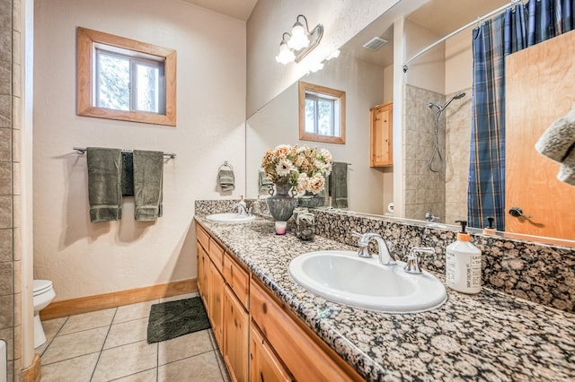40862 Village Pass Ln, Shaver Lake, CA 93664 - bathroom with double vanity, a tile shower, and tile patterned floors