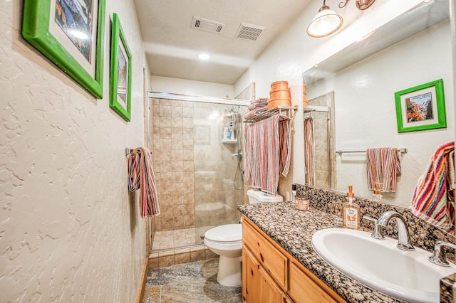 40862 Village Pass Ln, Shaver Lake, CA 93664 - bathroom featuring a shower stall, vanity, and a textured wall
