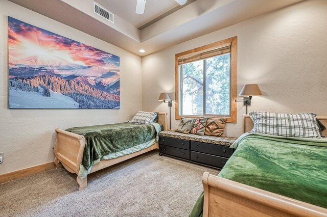 40862 Village Pass Ln, Shaver Lake, CA 93664 - bedroom with carpet, a textured wall, ceiling fan, and a raised ceiling