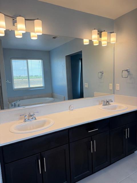 3963 Morris Ave, Clovis, CA 93619 - full bath featuring double vanity and a garden tub
