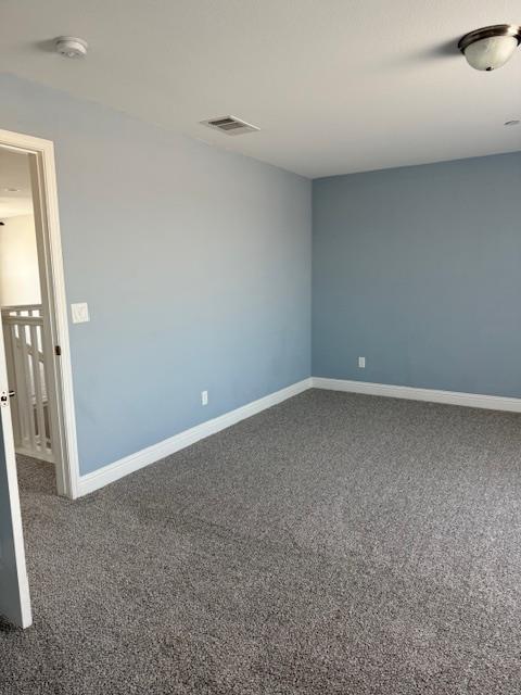 3963 Morris Ave, Clovis, CA 93619 - spare room featuring carpet flooring and a smoke detector