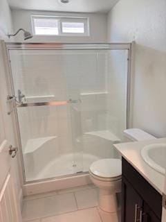 3963 Morris Ave, Clovis, CA 93619 - full bathroom with tile patterned floors, a stall shower, and vanity