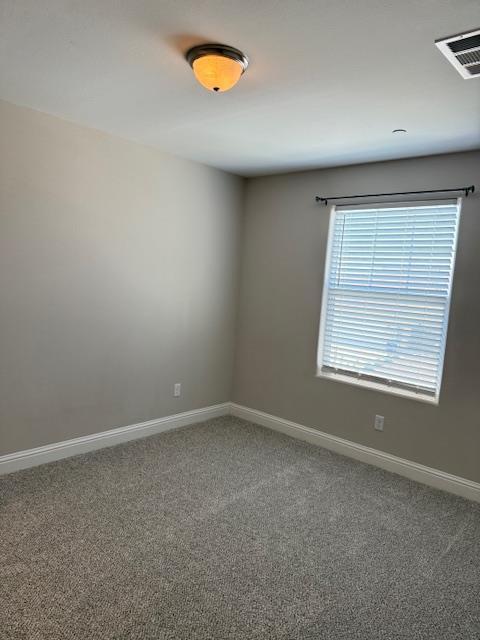 3963 Morris Ave, Clovis, CA 93619 - empty room featuring carpet floors and baseboards