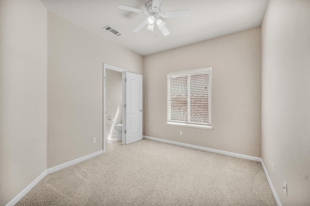439 W Serena Ave, Clovis, CA 93619 - unfurnished bedroom featuring light colored carpet, connected bathroom, and a ceiling fan