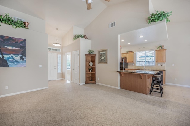 439 W Serena Ave, Clovis, CA 93619 - living room with high vaulted ceiling, ceiling fan, and light colored carpet