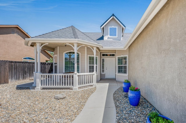 439 W Serena Ave, Clovis, CA 93619 - view of exterior entry featuring a porch and roof with shingles